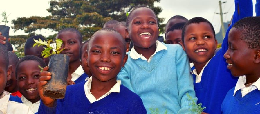 A large group of school students smiling